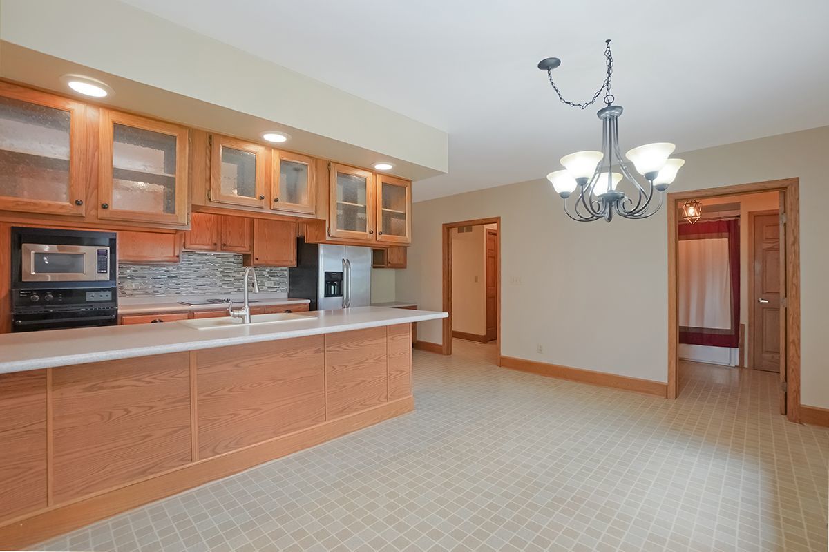 10057 Cherry Valley Road Genoa, IL 60135 - Photo 9 of 32 a view of kitchen with chandelier