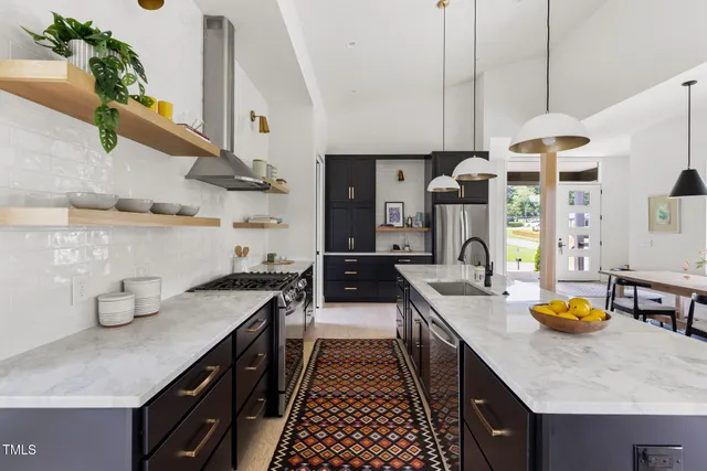 a kitchen with lots of counter space and wooden floor