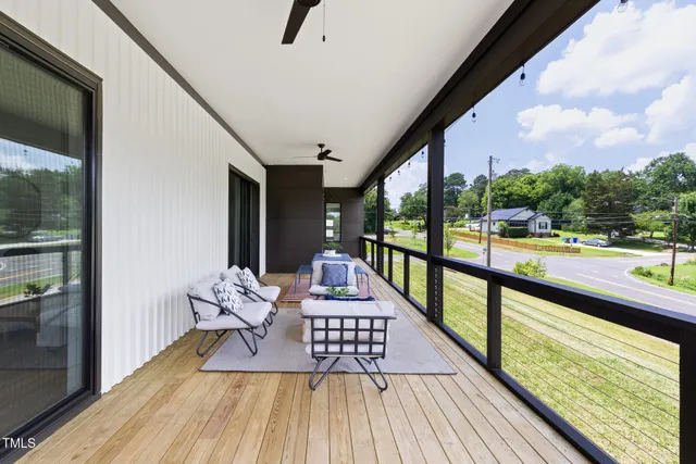 a view of balcony with couch and wooden floor