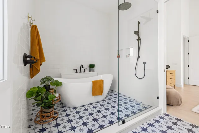 a bedroom with a rug and a couch