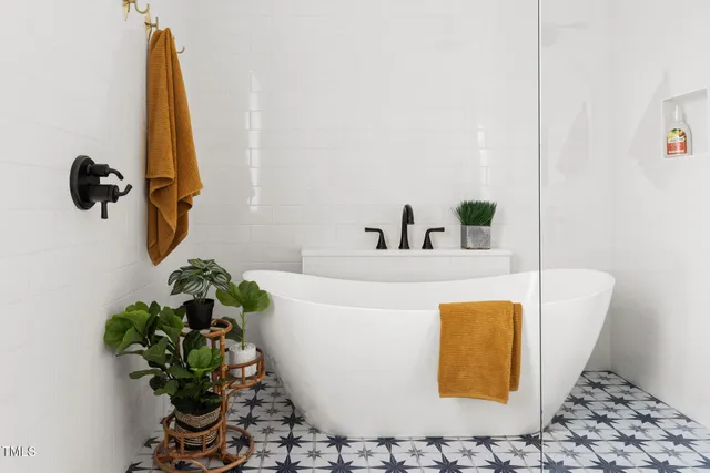 a bathroom with a potted plant