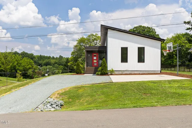 a front view of a house with yard