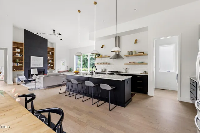a living room with granite countertop furniture and a fireplace
