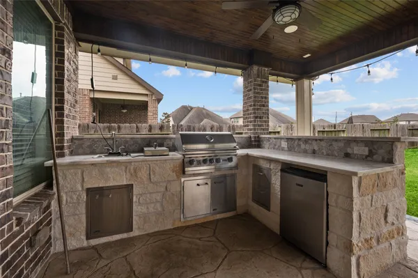 a kitchen with a stove and a sink