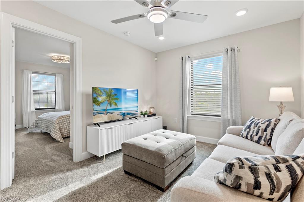 2147 Yellowfin Circle Naples, FL 34114 - Photo 14 of 34 a living room with furniture and a flat screen tv