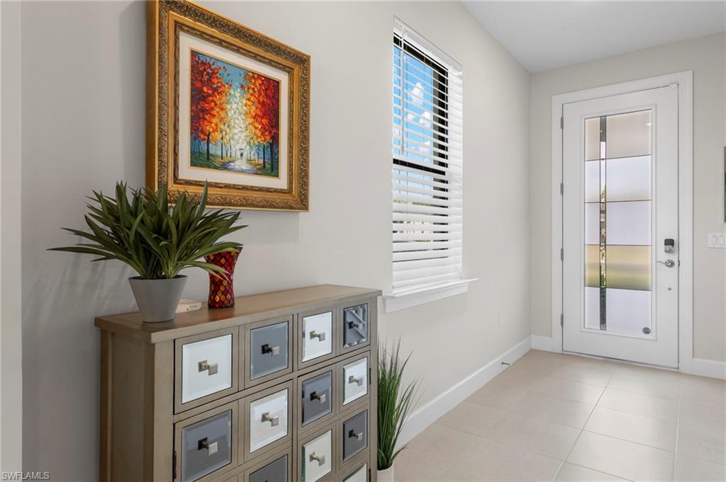 2147 Yellowfin Circle Naples, FL 34114 - Photo 2 of 34 a view of livingroom with furniture and wooden floor