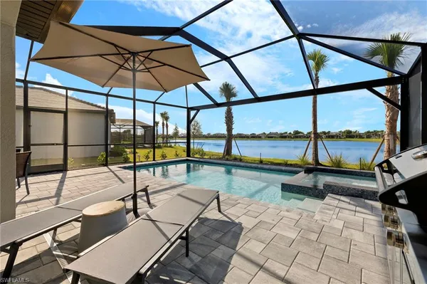 a view of a swimming pool with a lounge chairs
