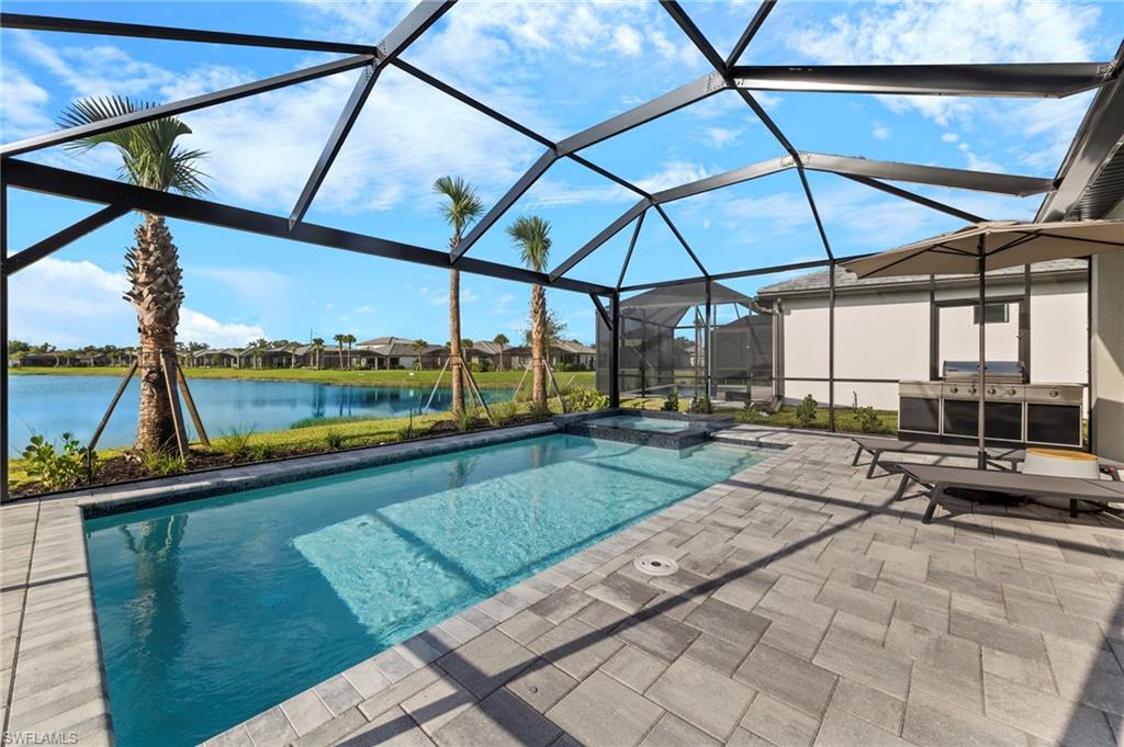 2147 Yellowfin Circle Naples, FL 34114 - Photo 28 of 34 a view of a swimming pool with a patio
