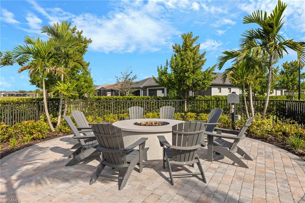 2147 Yellowfin Circle Naples, FL 34114 - Photo 32 of 34 a view of patio with table and chairs and potted plants