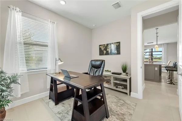 a workspace with furniture and a potted plant