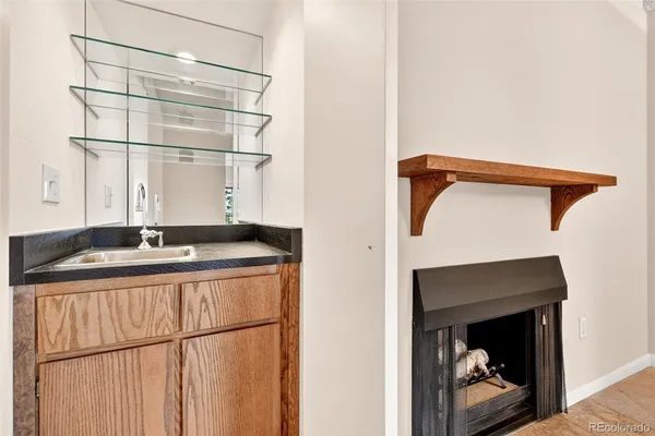 a utility room with a sink and a washing machine