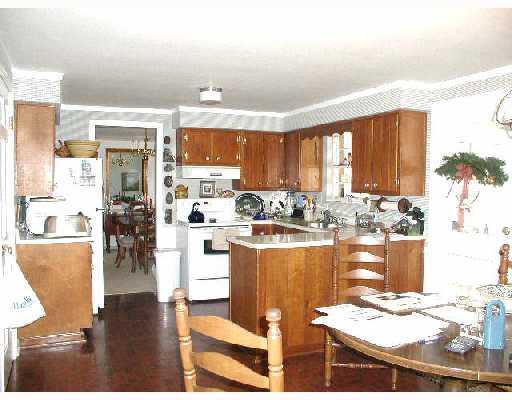 673 Blue Ridge Road Plum, PA 15239 - Photo 5 of 8 Kitchen. NOTICE THE LARGE WORK AREA WITH PLENTY OF CABINETRY FOR THE GOURMET COOK.THIS ADEQUATELY SIZED BREAKFAST AREA IS OPEN AND AIRY - AND JUST PLAIN SUPERB - AND EASY ACCESS TO THE THREE SEASON ROOM