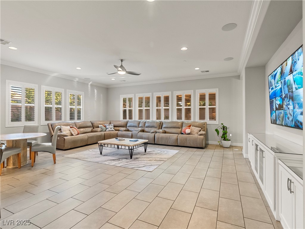 8775 Helena Avenue Las Vegas, NV 89129 - Photo 18 of 72 Living room featuring ornamental molding, a ceiling fan, recessed lighting, and light tile patterned flooring