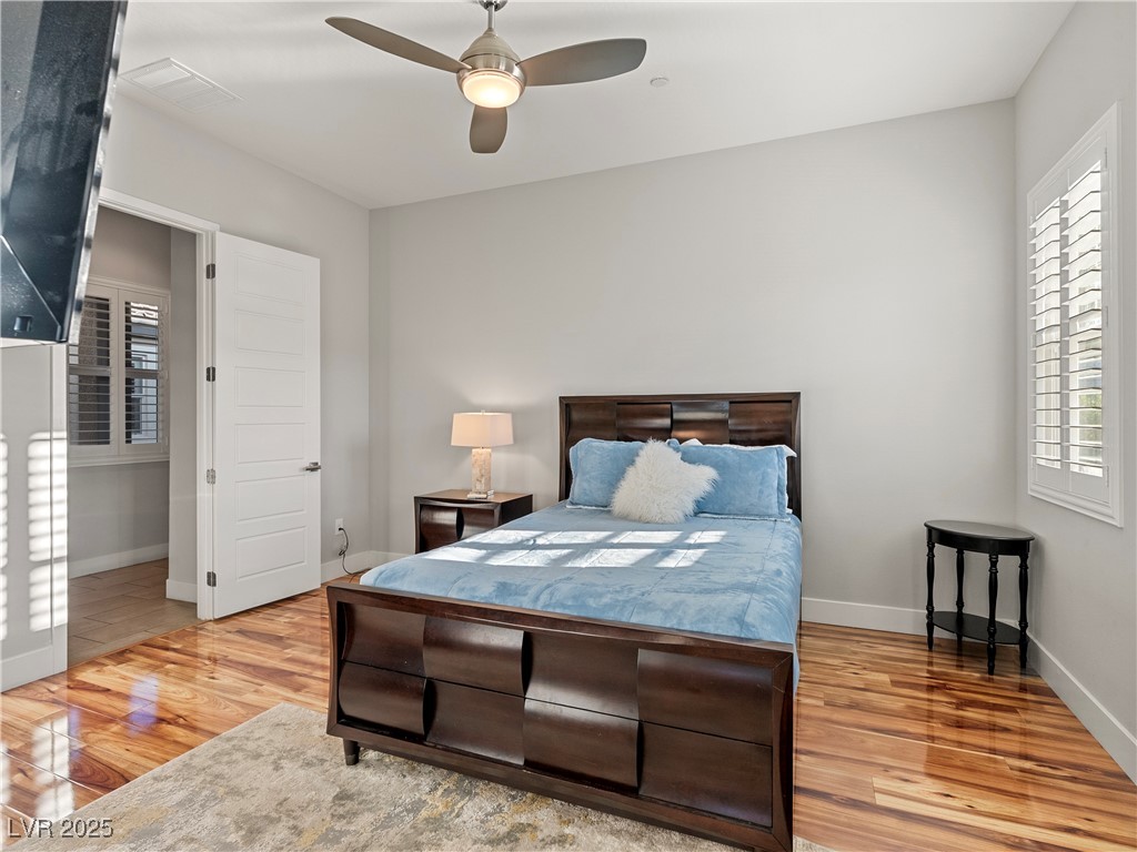 8775 Helena Avenue Las Vegas, NV 89129 - Photo 29 of 72 Bedroom featuring light wood-type flooring and ceiling fan