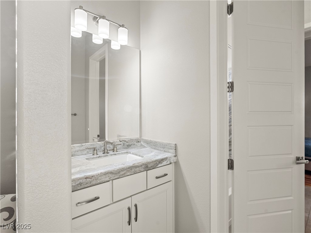 8775 Helena Avenue Las Vegas, NV 89129 - Photo 30 of 72 Half bathroom with vanity