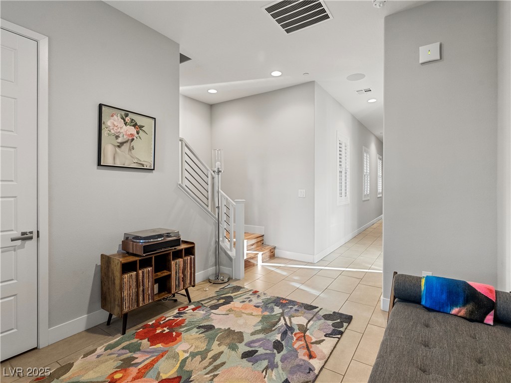 8775 Helena Avenue Las Vegas, NV 89129 - Photo 35 of 72 Entrance foyer featuring light tile patterned flooring, recessed lighting, and stairs