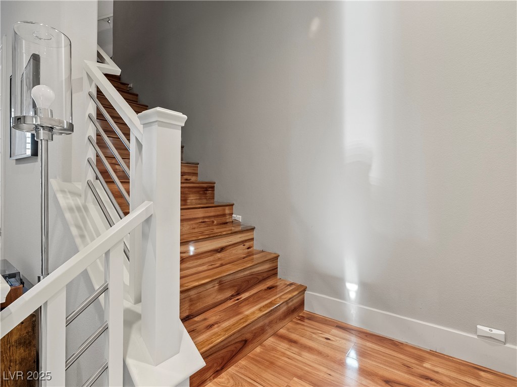 8775 Helena Avenue Las Vegas, NV 89129 - Photo 36 of 72 Staircase featuring wood finished floors and baseboards
