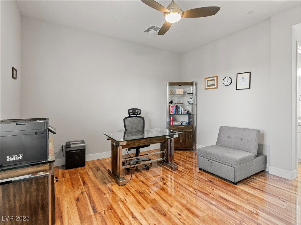 8775 Helena Avenue Las Vegas, NV 89129 - Photo 37 of 72 Office with light wood-type flooring and a ceiling fan