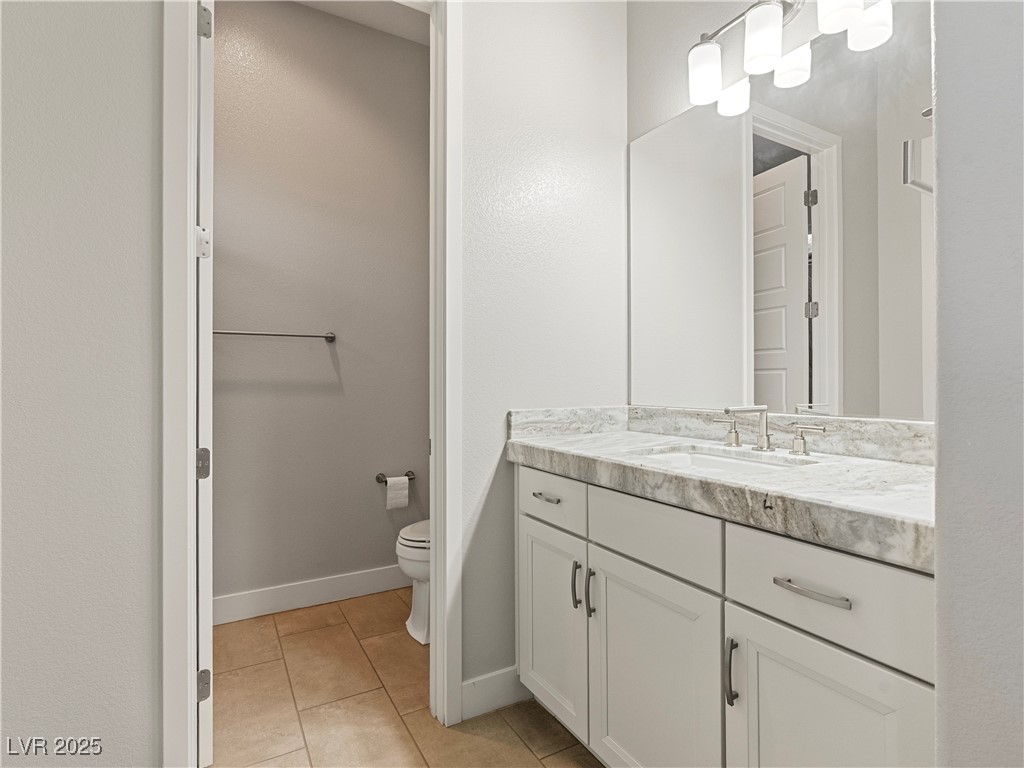 8775 Helena Avenue Las Vegas, NV 89129 - Photo 48 of 72 Bathroom with vanity and light tile patterned floors