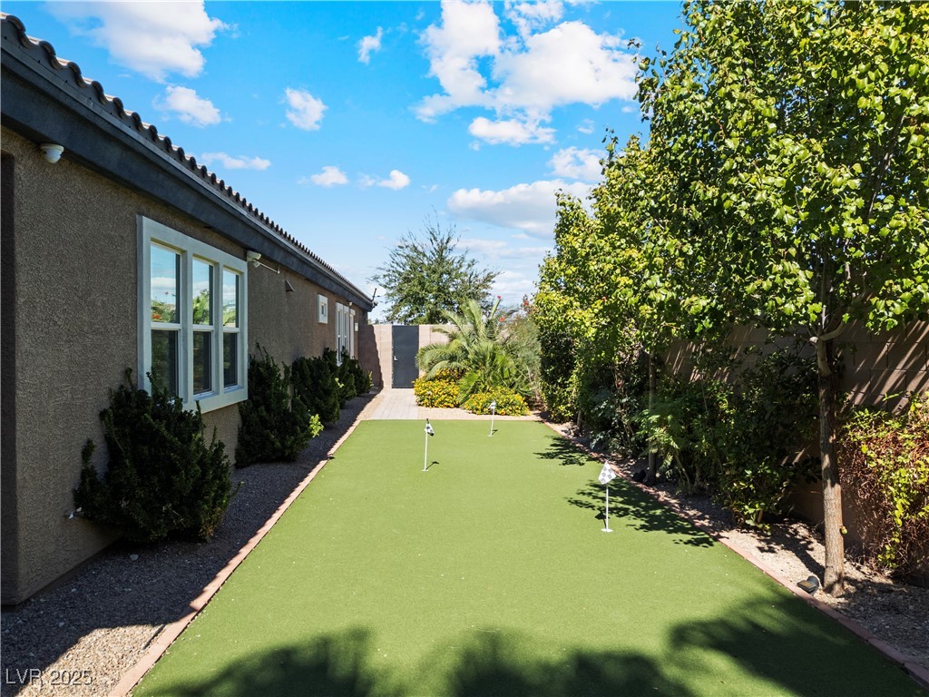 8775 Helena Avenue Las Vegas, NV 89129 - Photo 54 of 72 Fenced backyard with a putting green