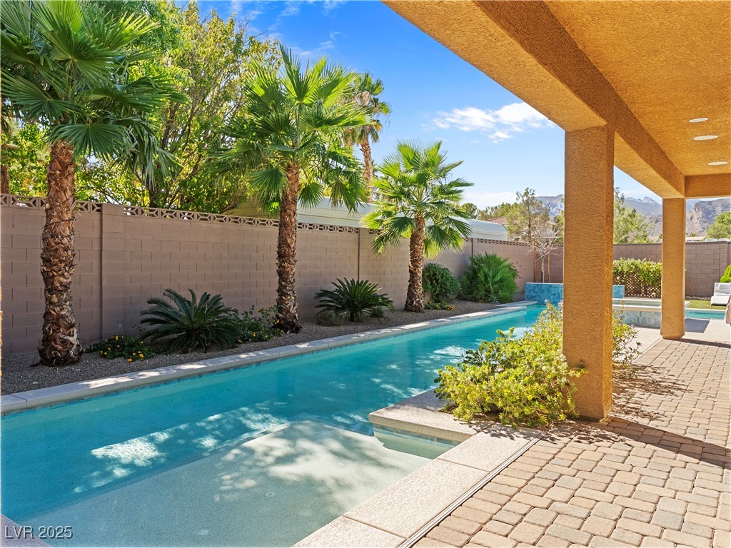 8775 Helena Avenue Las Vegas, NV 89129 - Photo 60 of 72 View of swimming pool with a patio area and a fenced backyard