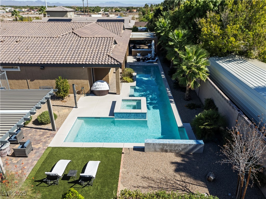 8775 Helena Avenue Las Vegas, NV 89129 - Photo 69 of 72 View of pool featuring a patio area, a pool with connected hot tub, a mountain view, and a pergola