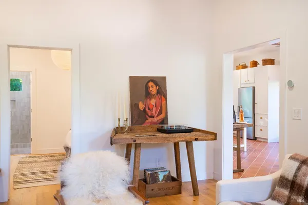 a dining room with furniture and wooden floor