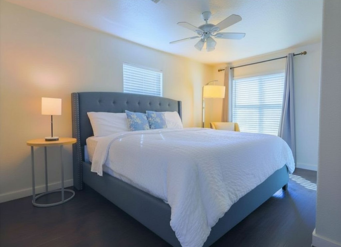 831 Rouse Street Houston, TX 77020 - Photo 8 of 19 a bed sitting in a bedroom next to a window and a chandelier