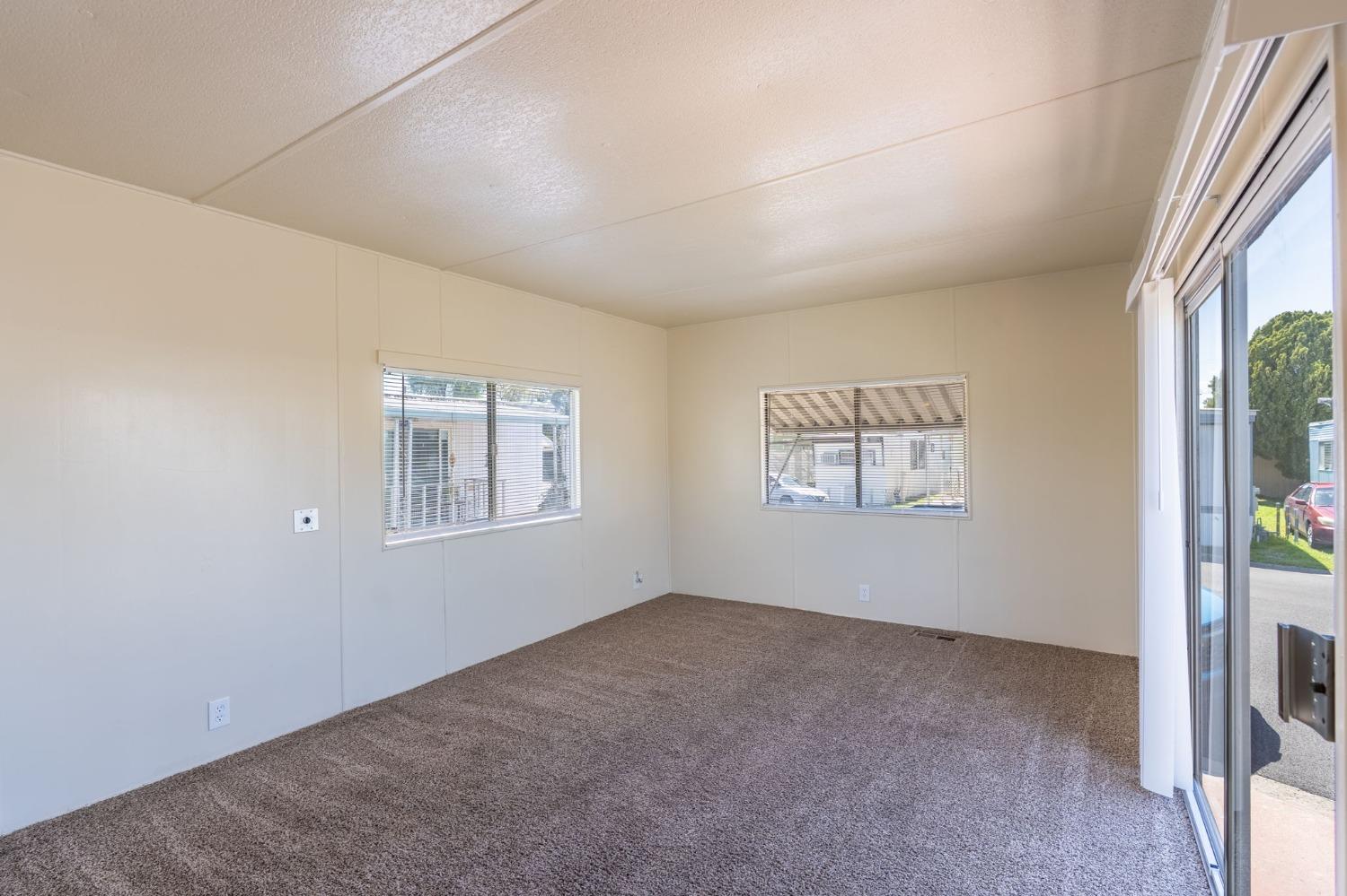 5835 Cherokee Road, Unit 7 Stockton, CA 95215 - Photo 10 of 16 an empty room with windows