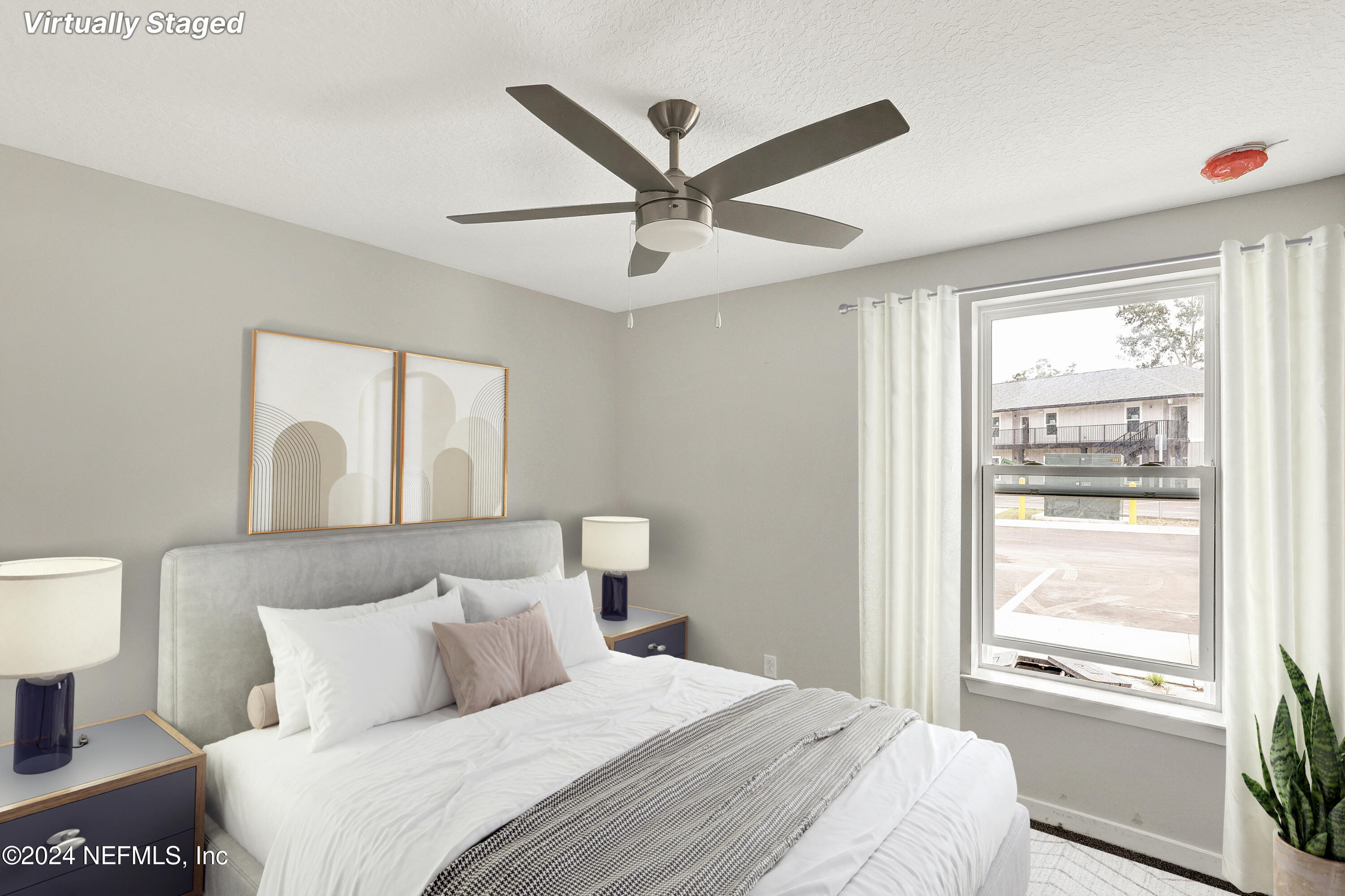 10109 Old St Augustine Road, Unit 1104 Jacksonville, FL 32257 - Photo 2 of 10 a bedroom with a large bed and a window