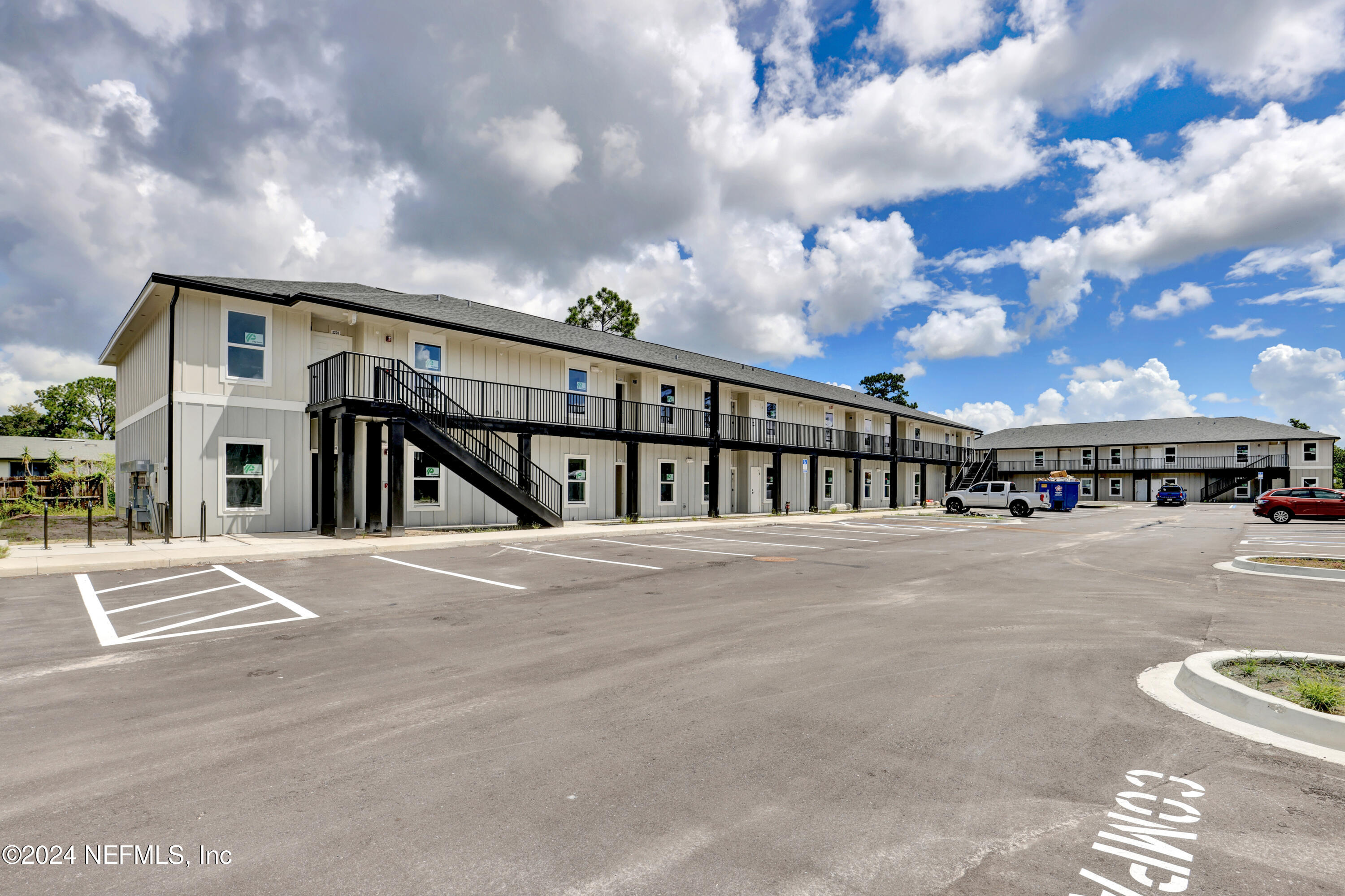 10109 Old St Augustine Road, Unit 1104 Jacksonville, FL 32257 - Photo 6 of 10 a view of building with car parked