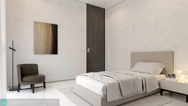 a living room with furniture and a open kitchen view