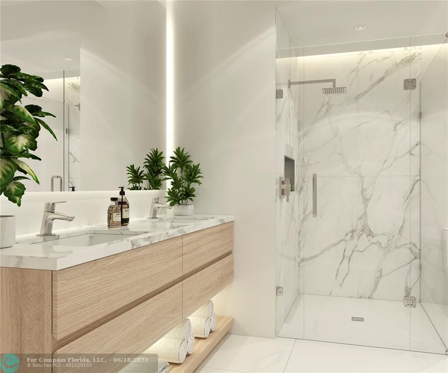 534 Hendricks Isle, Unit 302 Fort Lauderdale, FL 33301 - Photo 15 of 19 a bathroom with a sink and a mirror