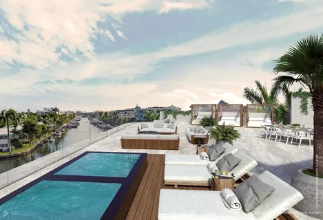 a view of roof deck with two chairs and a table