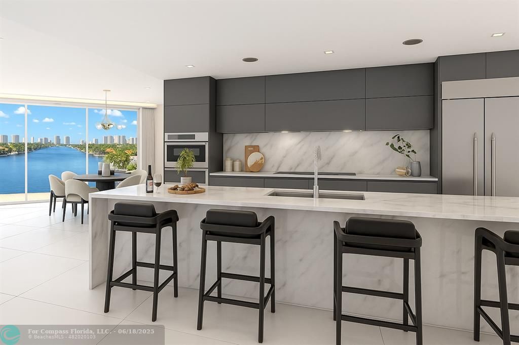534 Hendricks Isle, Unit 302 Fort Lauderdale, FL 33301 - Photo 7 of 19 a kitchen with a sink and chairs