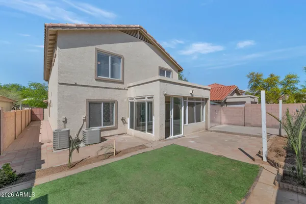 a house view with a backyard space