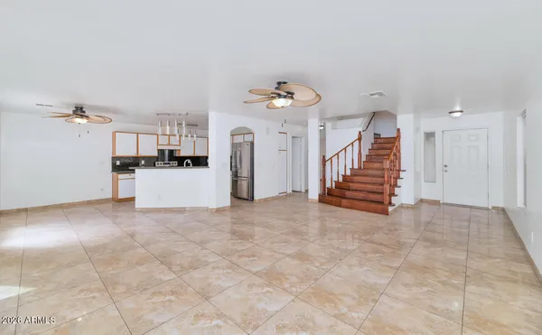 a view of a kitchen with furniture and staircase