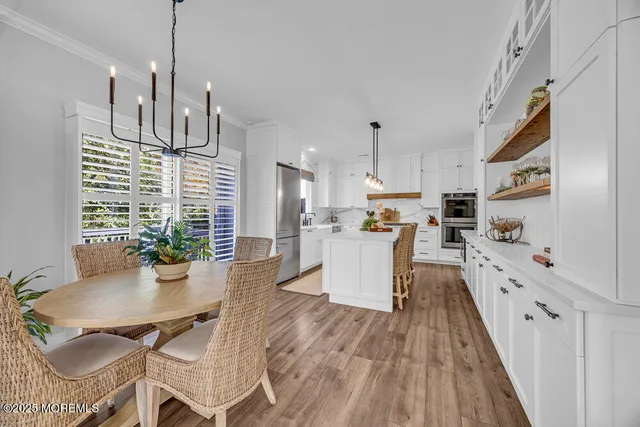 a kitchen with refrigerator and cabinets