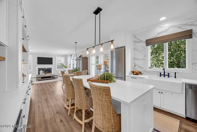 a bedroom with furniture and wooden floor