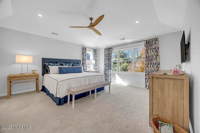 a bathroom with a double vanity sink mirror and bathtub