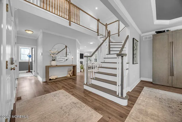a view of entryway dining room and hall with wooden floor