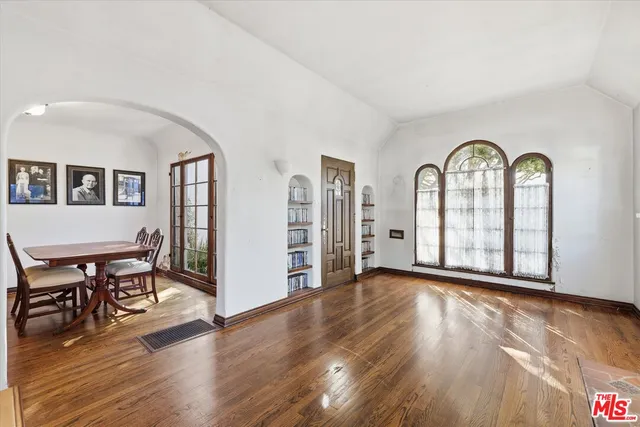 a view of a livingroom with furniture and hardwood floor