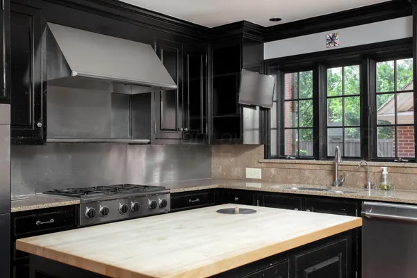 a view of a room with furniture and wooden floor