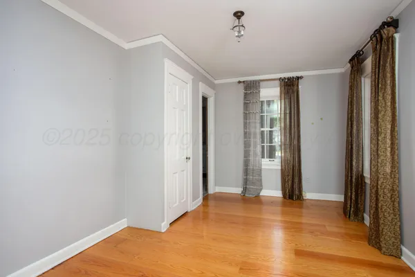 a bathroom with a granite countertop sink and a window