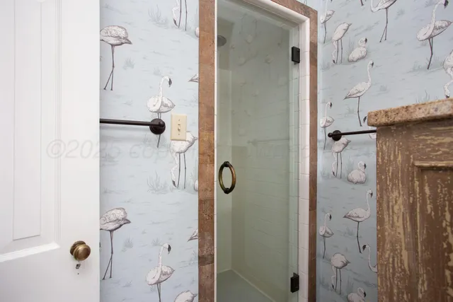 a view of a kitchen with wooden floor and a sink