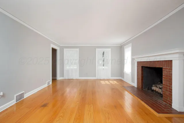 a view of front door with wooden floor