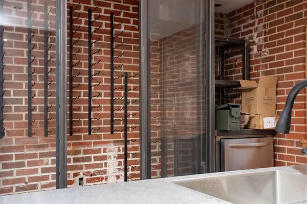 a bed with white sheets and a blanket