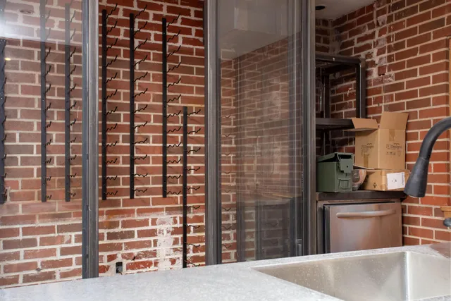 a bed with white sheets and a blanket