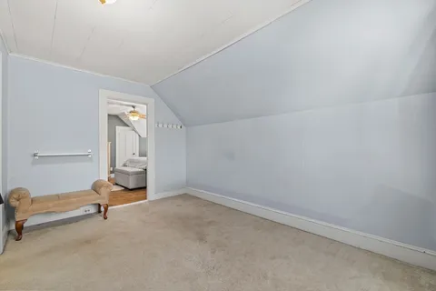 a view of a room with gym equipment and windows