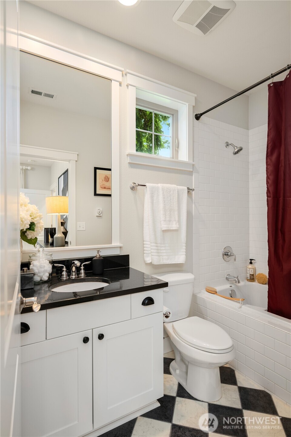 7709 17th Avenue Southwest Seattle, WA 98106 - Photo 16 of 37 a bathroom with a sink a toilet and a mirror